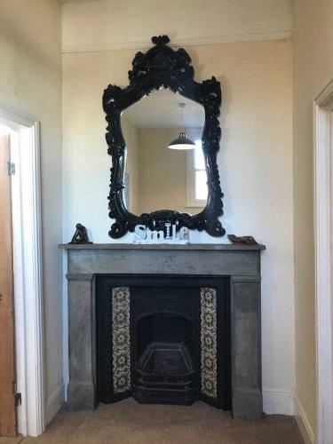 The Old Sorting Office fireplace in bedroom