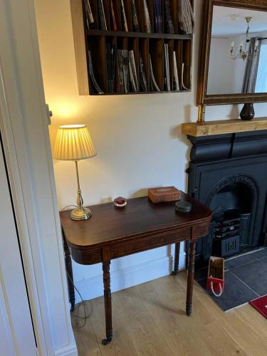 The Old Sorting Office side table near fire.